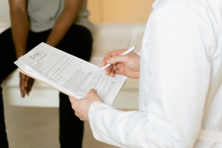 Doctor Explaining Medical Test Results on Clipboard