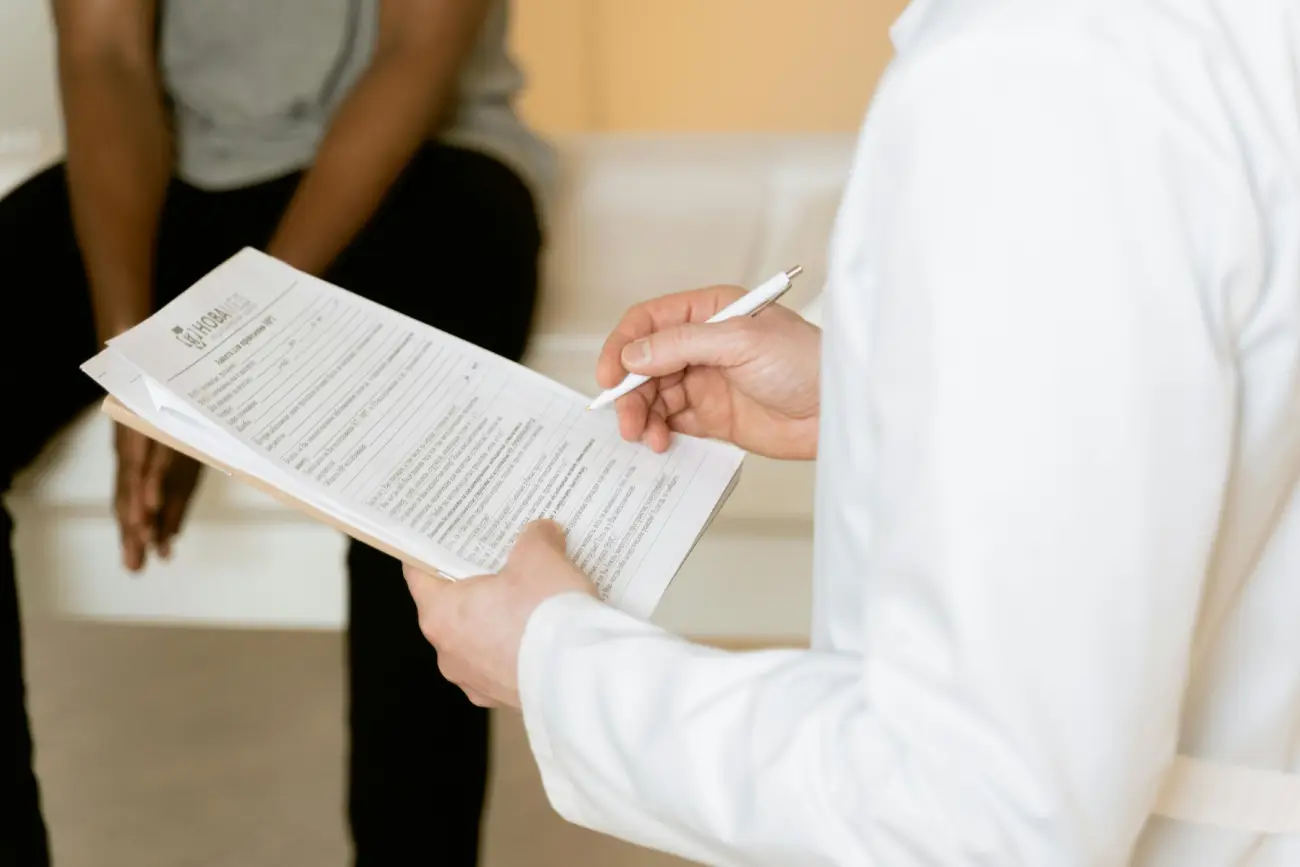 Doctor Explaining Medical Test Results on Clipboard